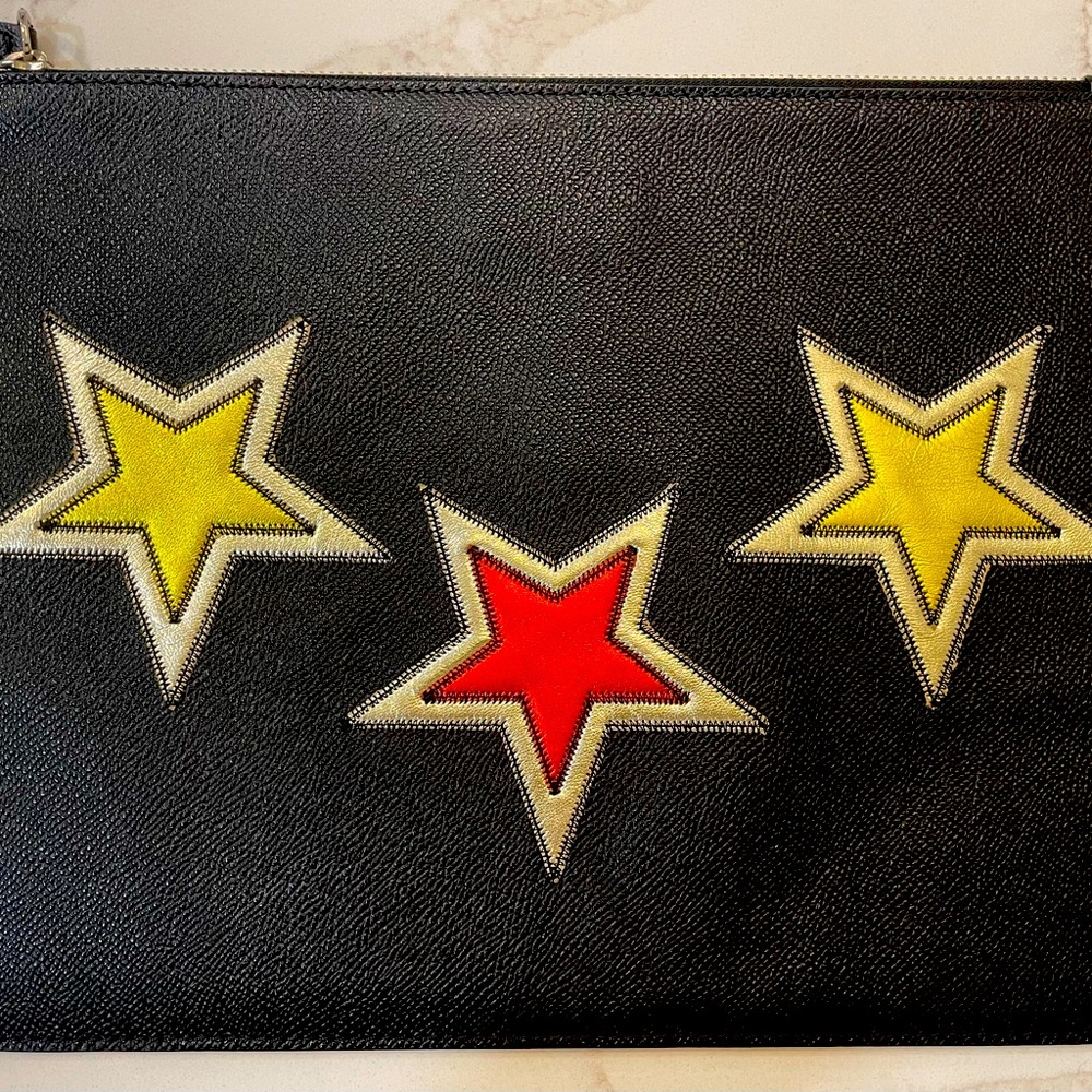 Givenchy metallic gold and red star embroidered pouch.